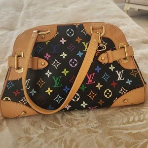 The Louis Vuitton Black Monogram Multicolore Claudia bag